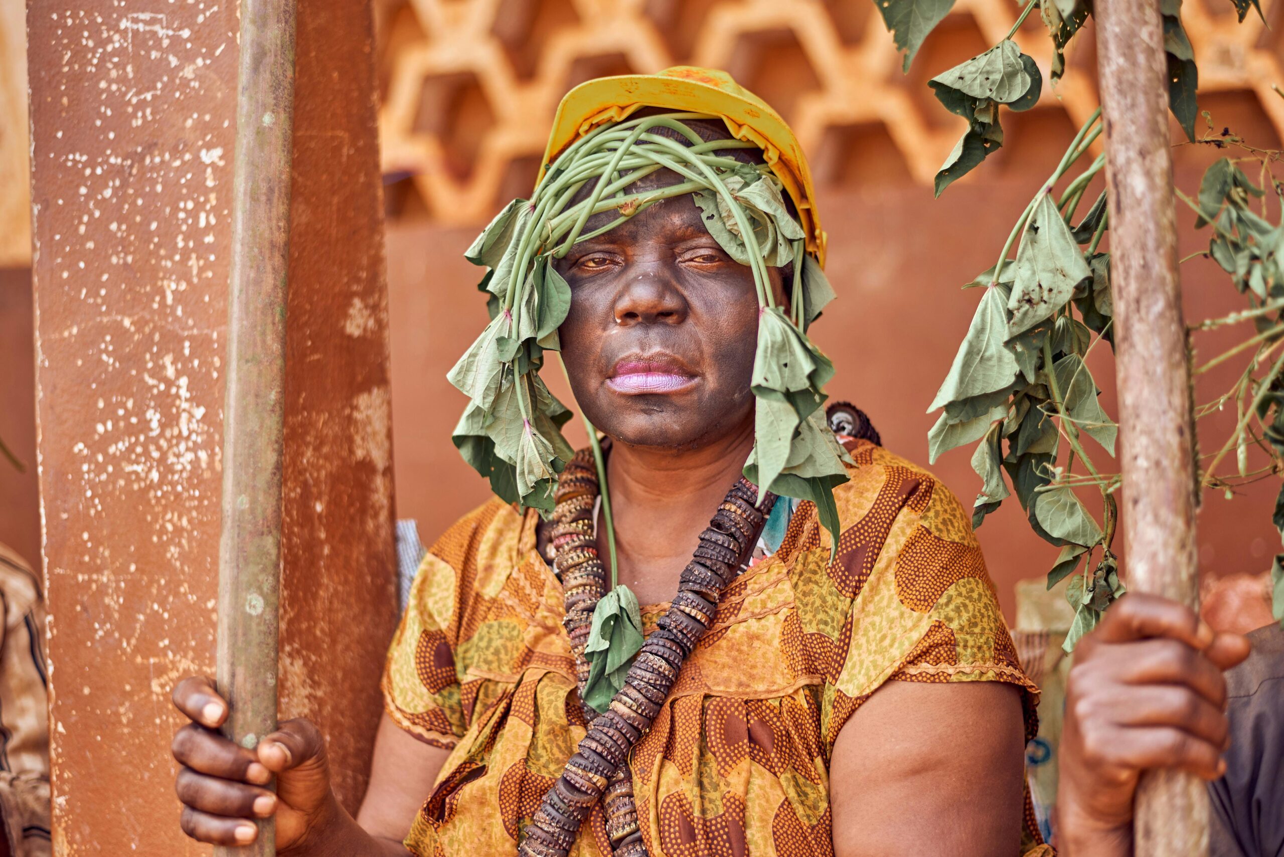 A person in traditional clothing participating in a cultural ceremony in Batoufam, Cameroon.