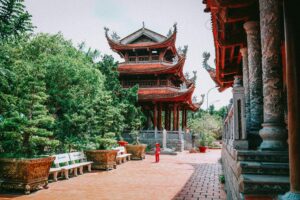 Explore the beauty and cultural heritage of a traditional Vietnamese pagoda surrounded by nature.